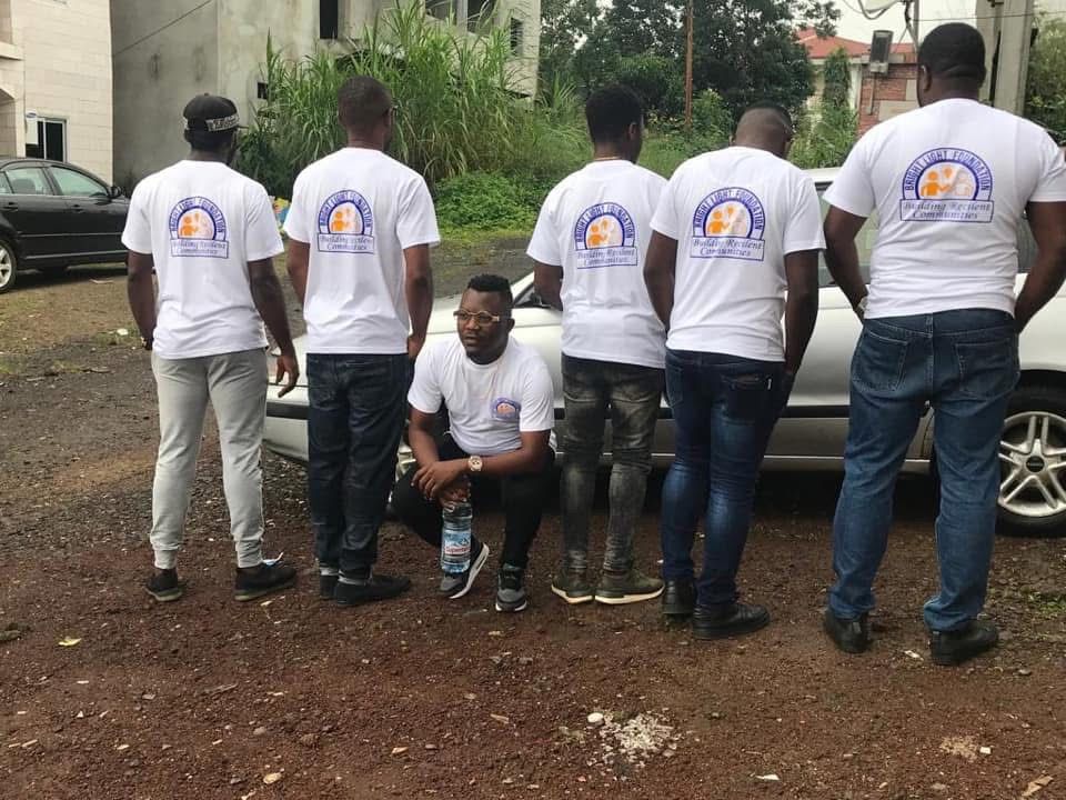 Foundation members distributing supplies to community members